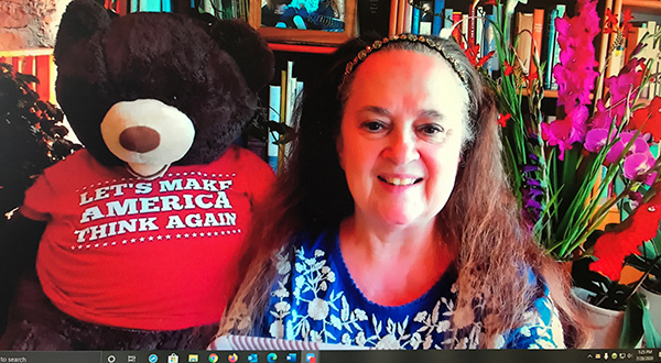 Emily with bear that says 'Let's make America think again'