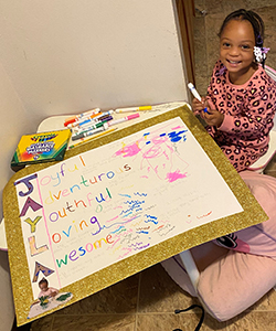 Odyssey Junior student with her artwork