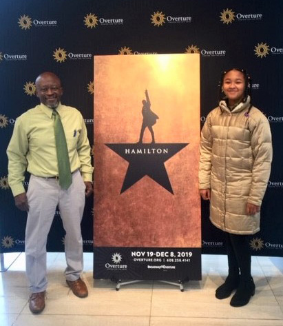 Bruce and Sidney pose with Hamilton sign