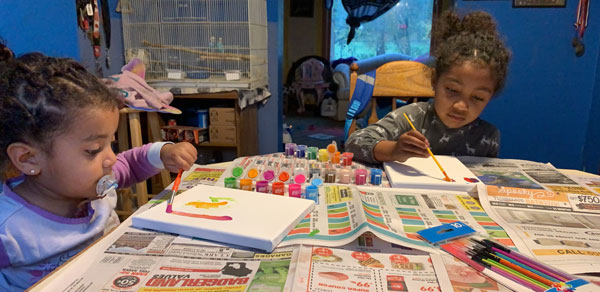 Layla and her sister, Naliyah painting