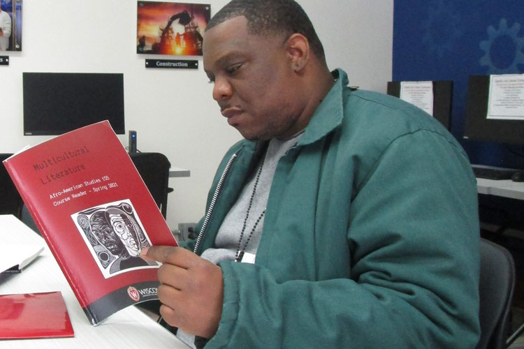 Devin, a student in Afro-American Studies 155 (spring 2021) reads a booklet