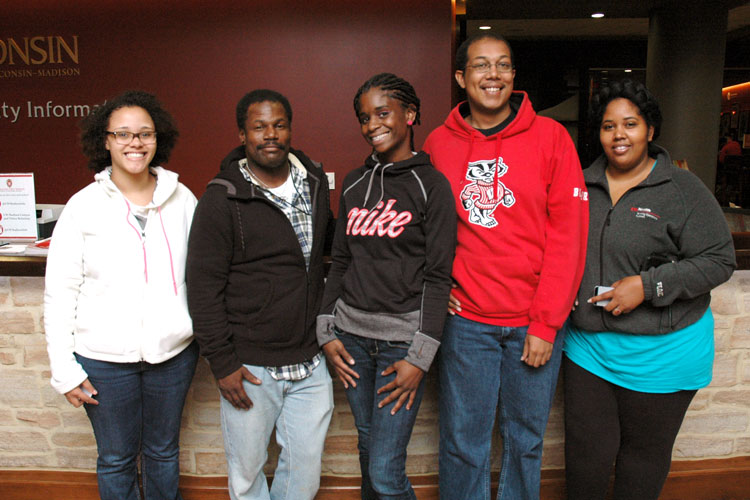 Odyssey student Anthony standing with his classmates at UW–Madison information desk