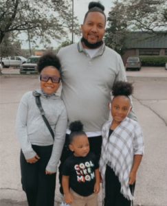 Ontario posing with his three children