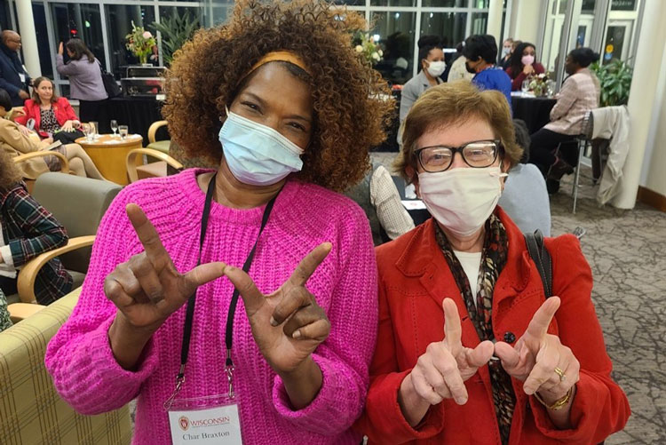 Chancellor Blank poses with Char Jackson, making the UW W hand sign