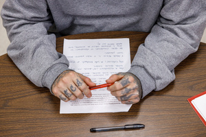 Student writing a poem