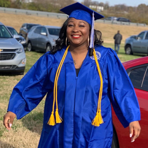 Kiara in her graduation cap and gown