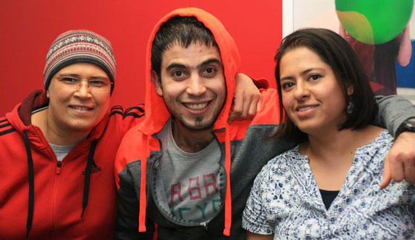 Joy with Ahmad and Grisel, Caption: “Odyssey graduate and monthly donor Joy (left) with classmates