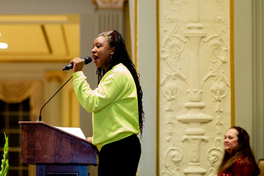 Woman speaking at podium