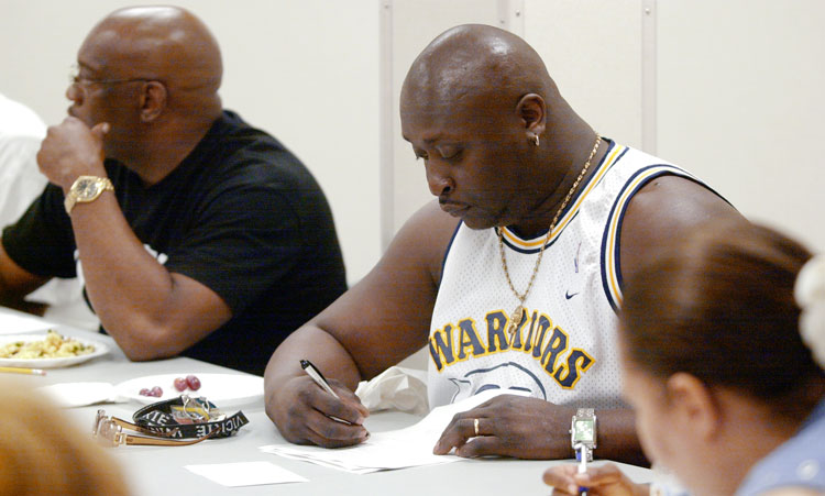 Joe Robinson signing paper