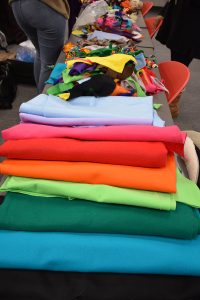 A stack of fabric for students to use in their capes