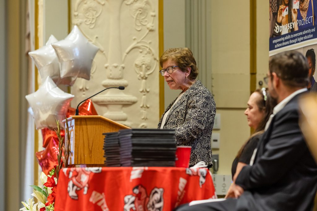 Former UW Chancellor Rebecca Blank speaking at podium for Odyssey graduation