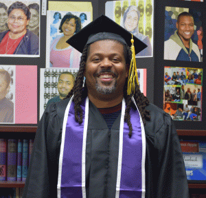 Corey Saffold in graduation cap and gown
