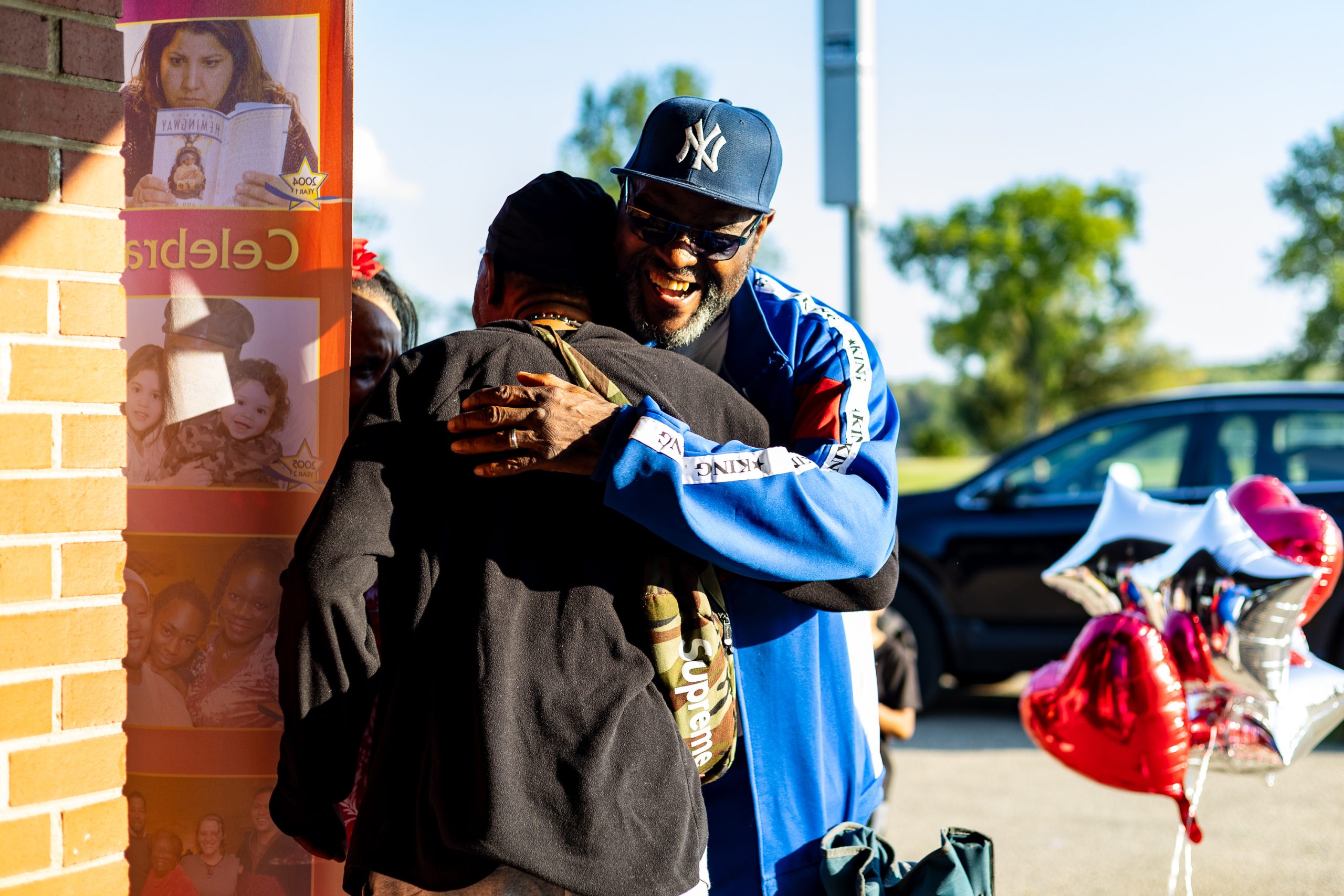Odyssey students, staff, community, etc, hugging