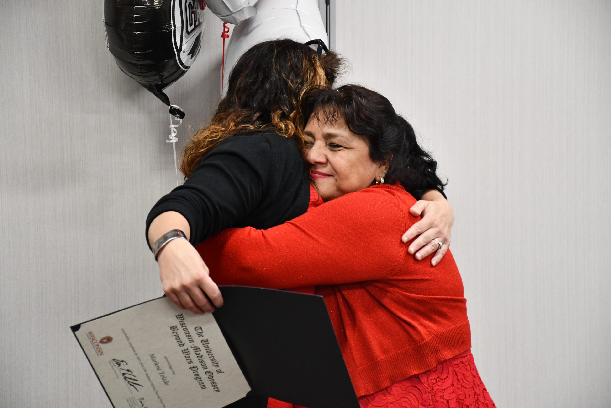 Odyssey students, staff, community, etc, hugging
