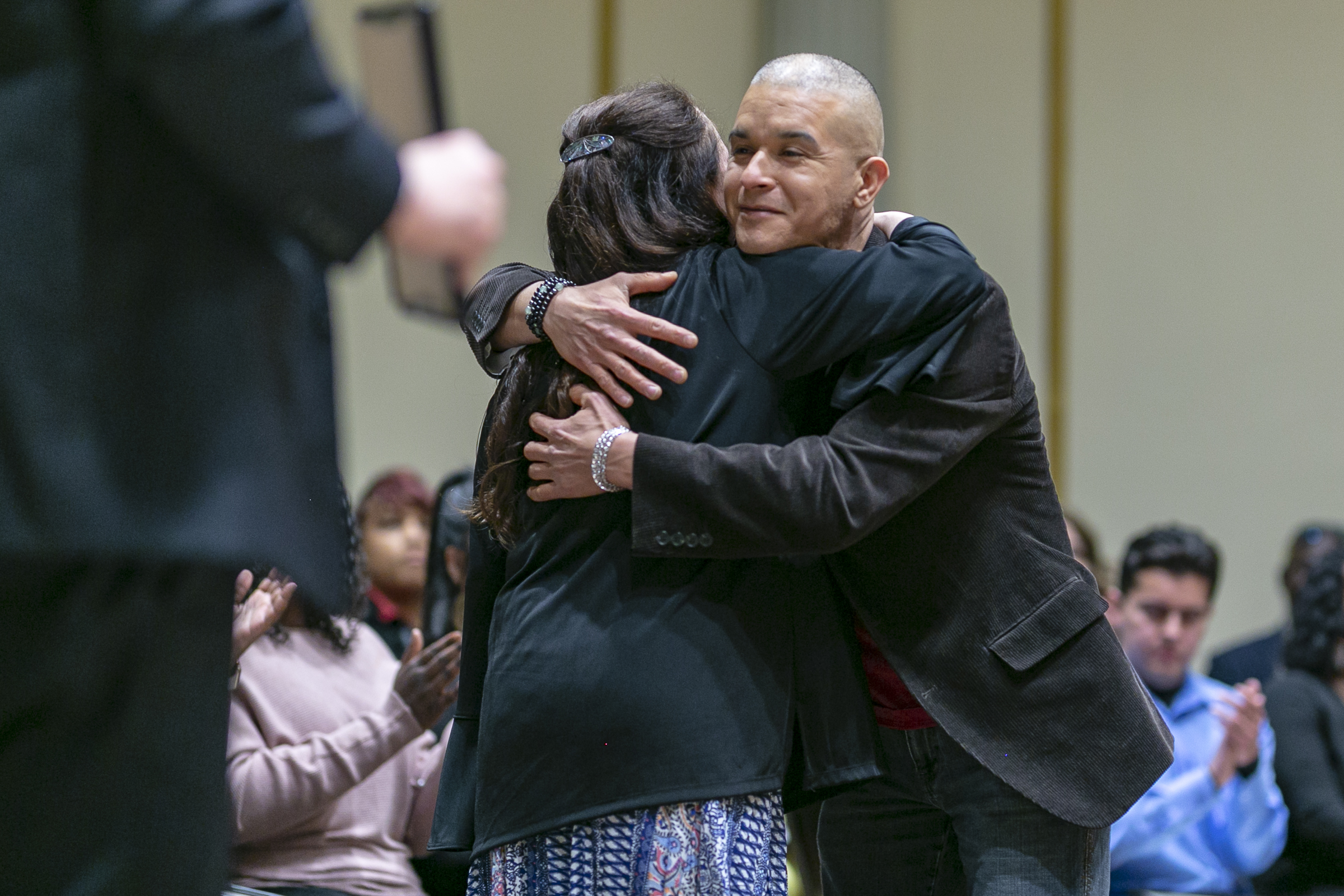 Odyssey students, staff, community, etc, hugging