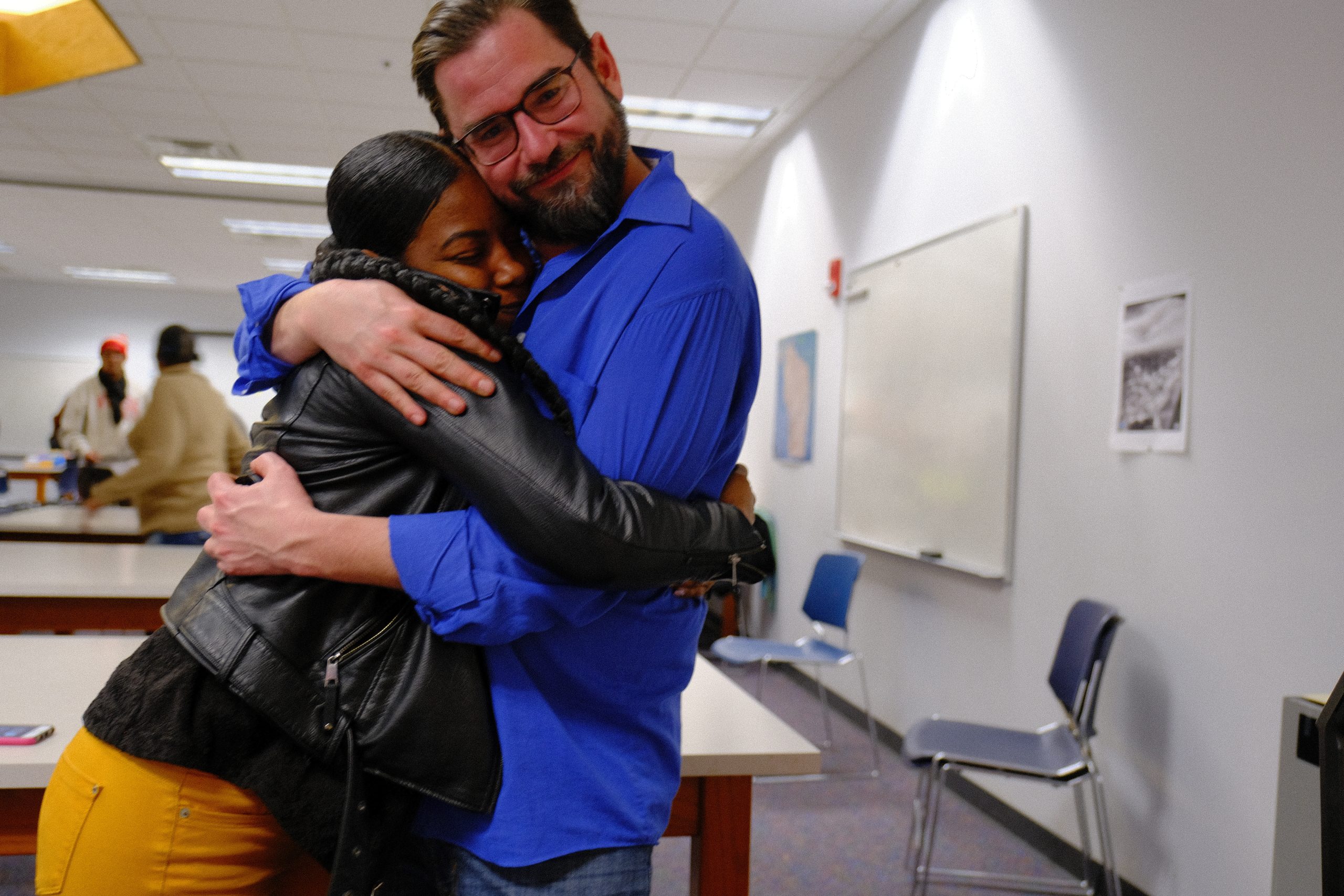Odyssey students, staff, community, etc, hugging
