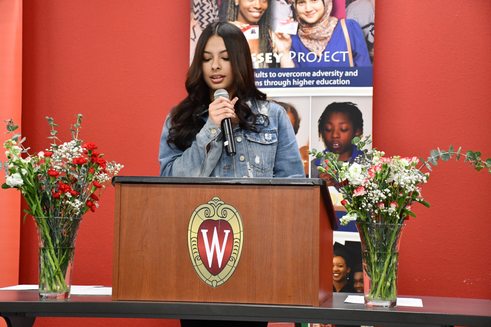 Odyssey Junior student speaking at a podium