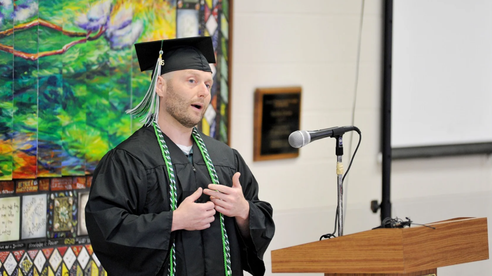 OBB participant in his graduation cap and gown